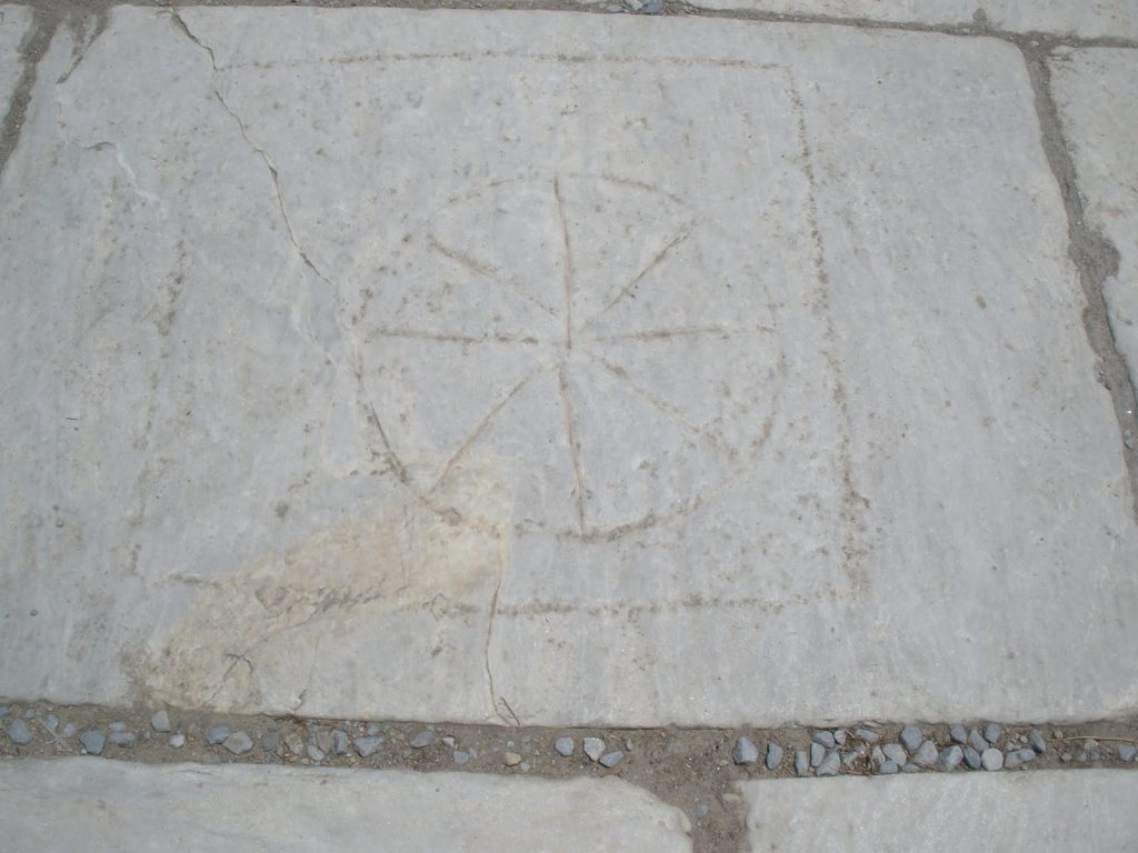 Rota carved into the floor tiles of Via Arcadia in Ephesus, Turkey. Photo: Juan Carlos Campos, July 2011.
