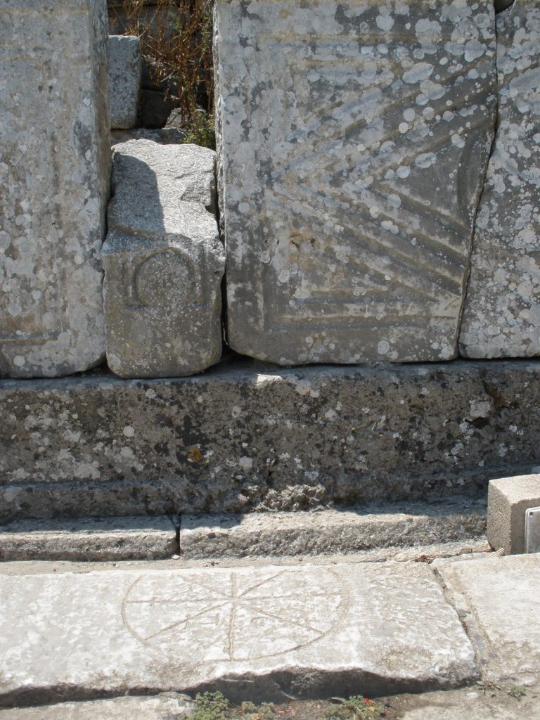 Rota carved into the floor tiles of the Marble Road in Ephesus, Turkey. Photo: Juan Carlos Campos, July, 2011.
