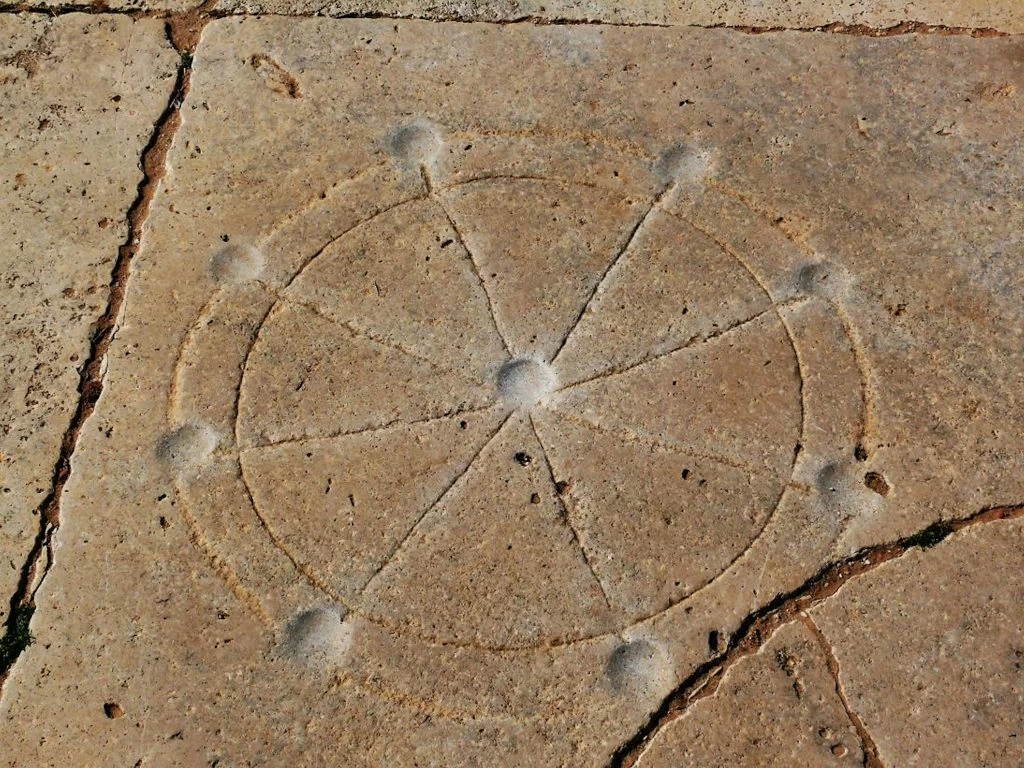 Roman Rota Game in the Old Forum, Leptis Magna, Libya. Photo: Pablo Novoa Alvarez, 2011.